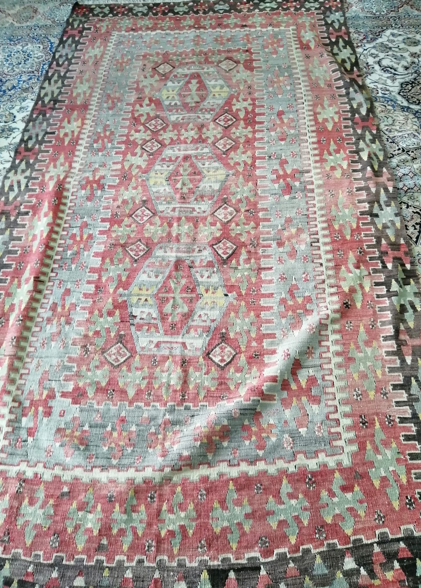 A flat weave Kilim rug, woven with lozenges in colours, approx. 320 x 160cm